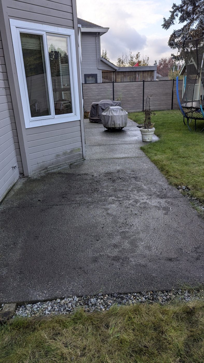 Clean concrete patio after hot tub removal, with the hot tub gone and the area swept