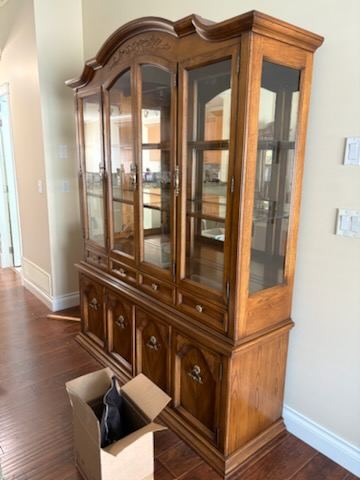 Wooden china cabinet and hutch ready for furniture removal