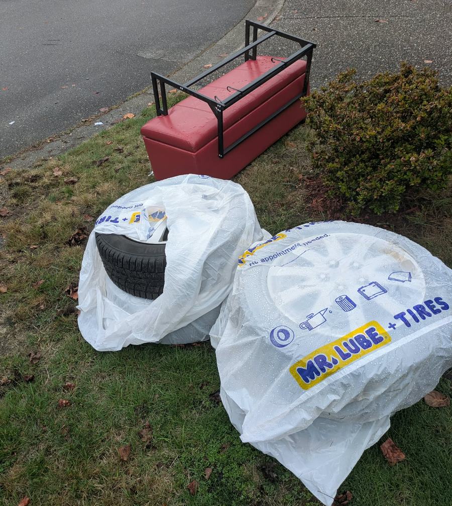 Used tires at the curb ready for tire disposal pickup